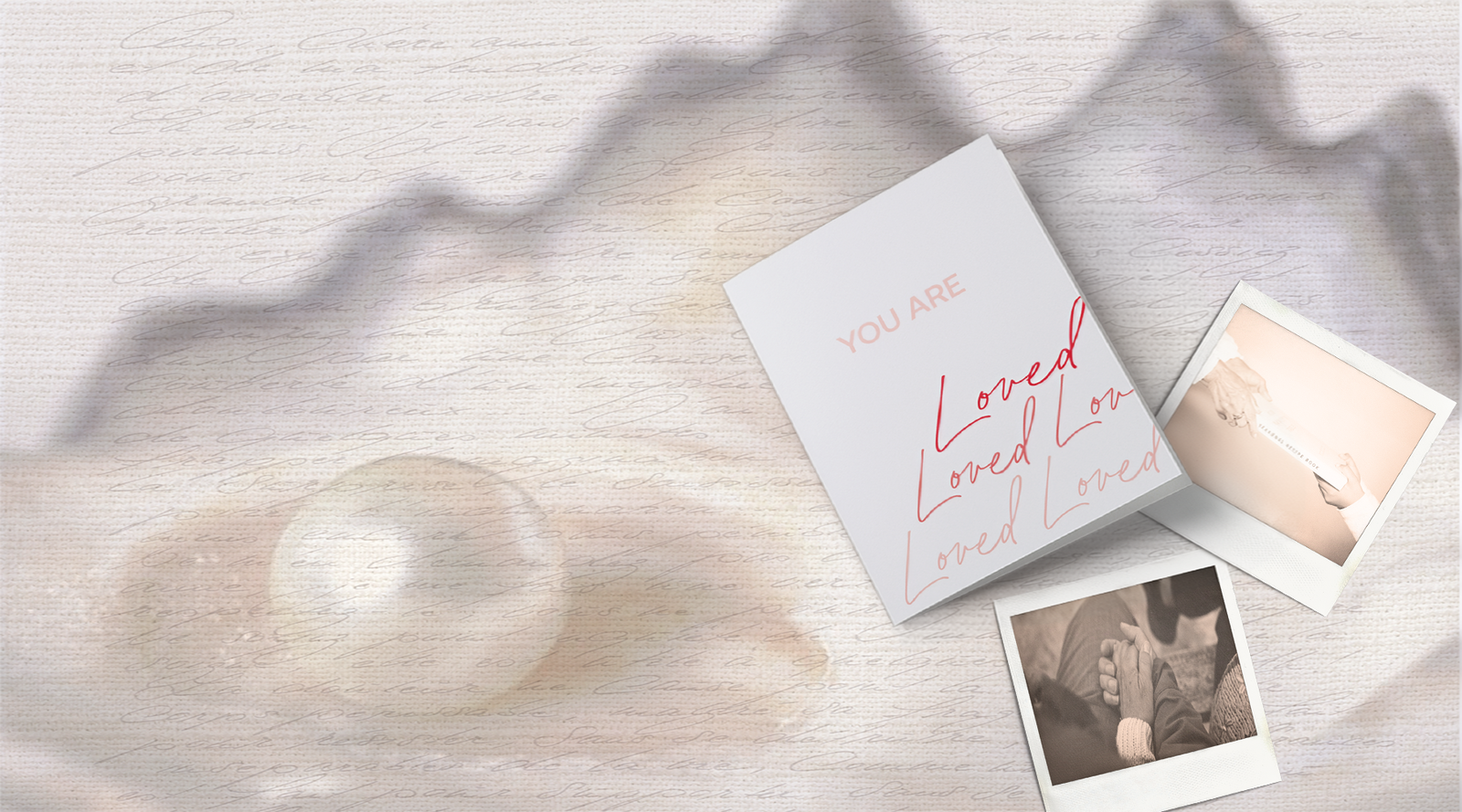 Hands holding gently with a red greeting card that reads ‘My world is so much brighter because you are in it’, representing quiet love, handwritten connection, and everyday care